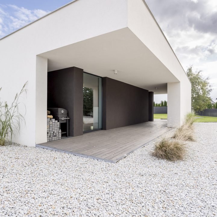 Backyard of modern, minimalistic house in daylight